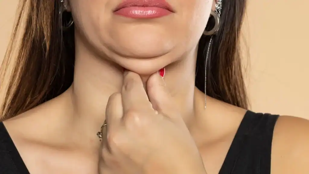 An image of a woman with double chin, sad, worried : Non Surgical Double Chin Removal Treatment in West Malling, UK